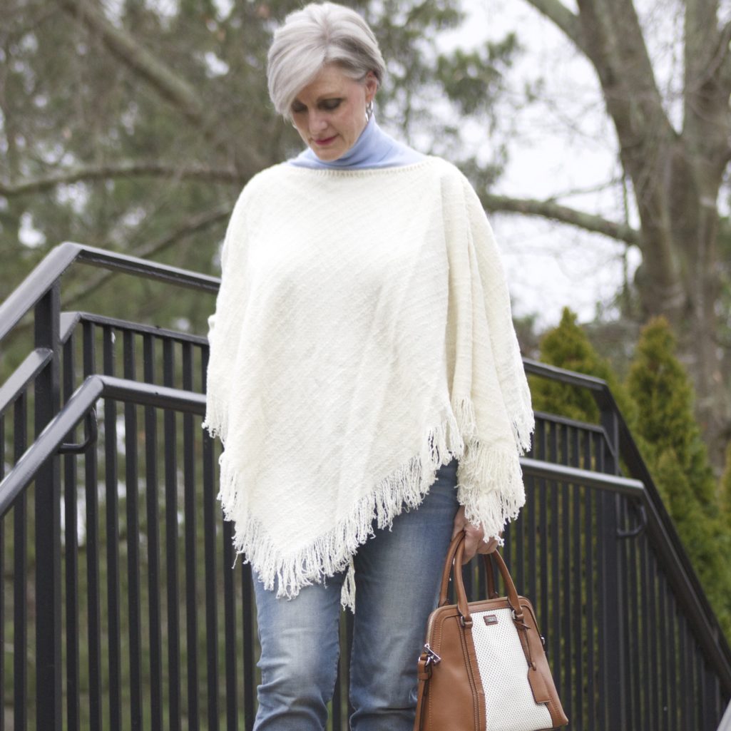put a poncho on