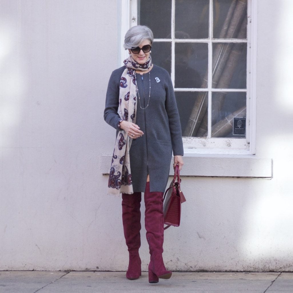 burgundy boots and statement handbag