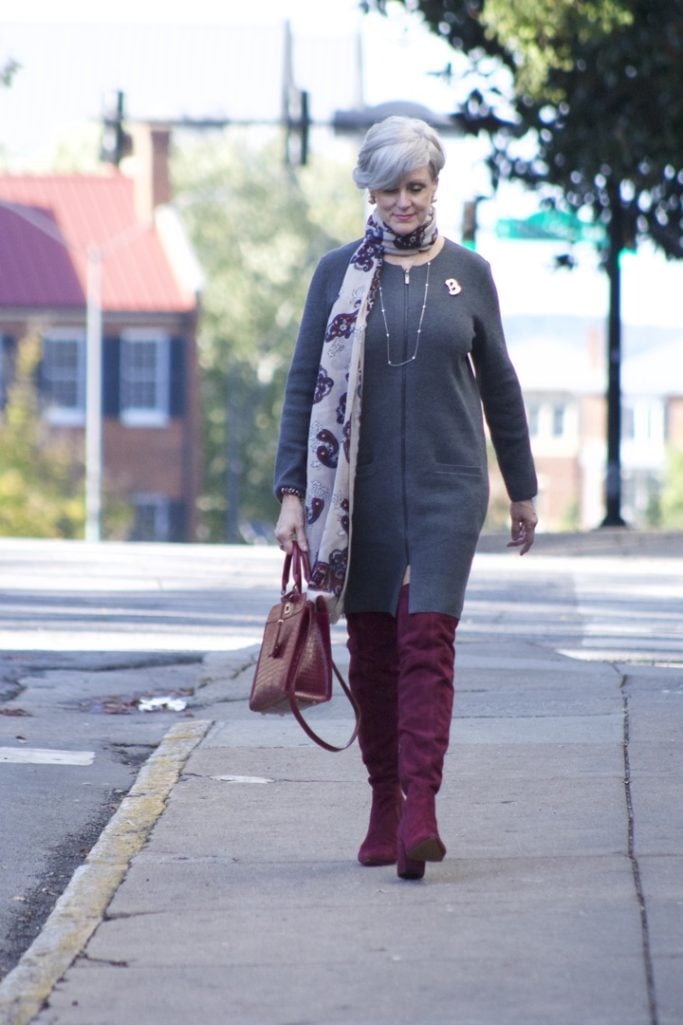 burgundy boots and statement handbag