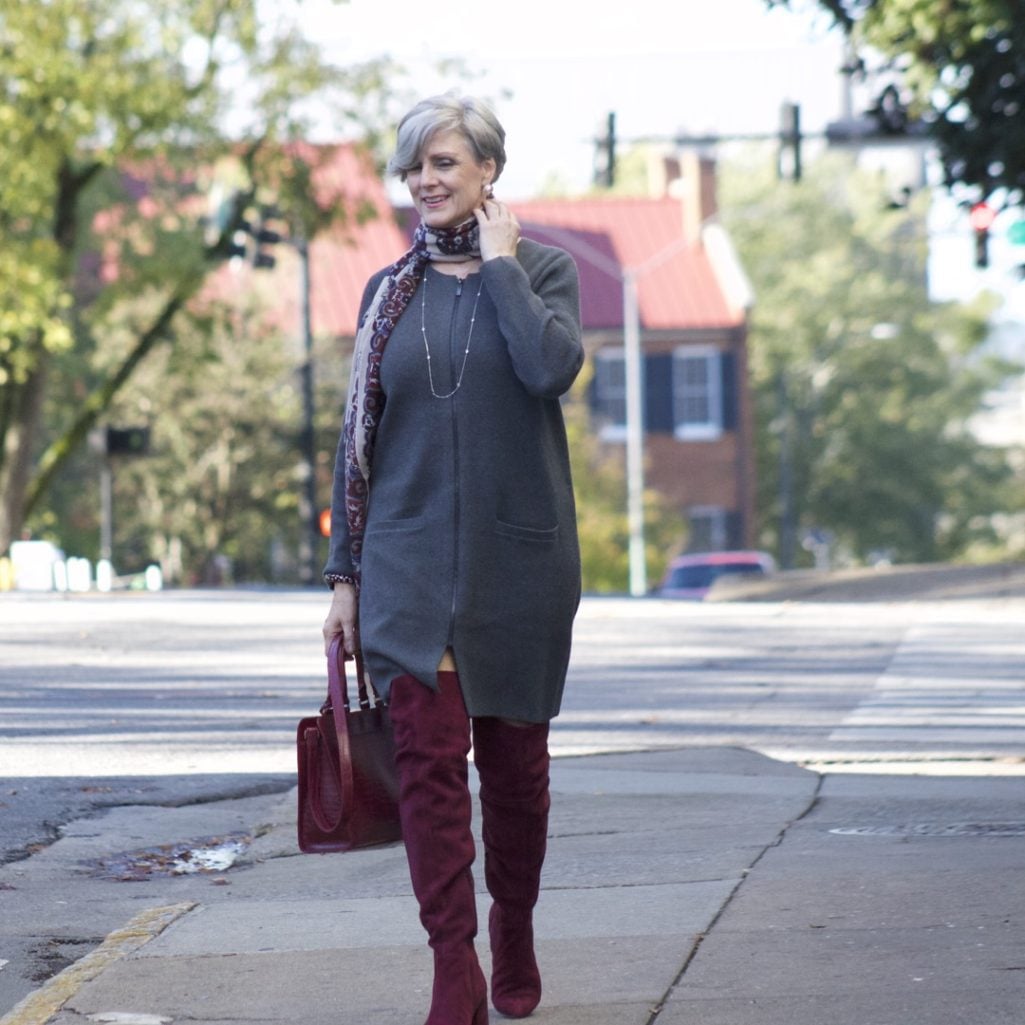 burgundy boots and statement handbag