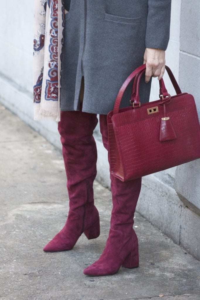 burgundy boots and statement handbag