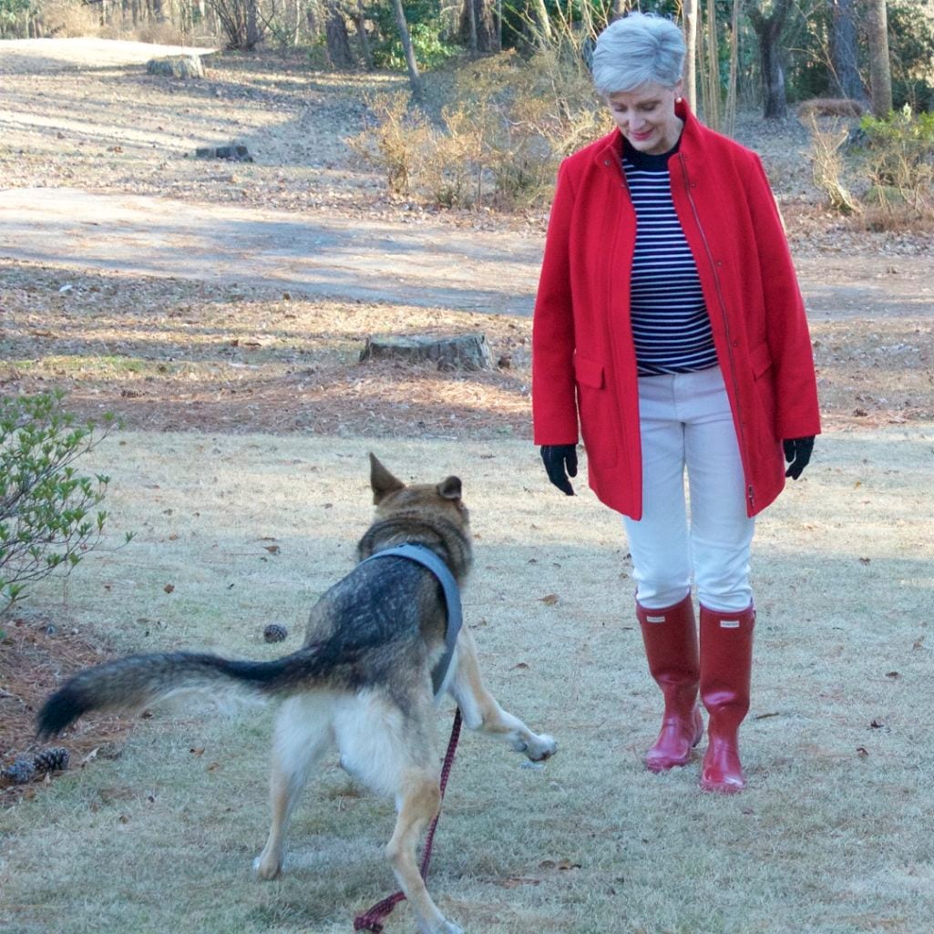 red stadium coat, striped crewneck, white denim, red hunter boots, houndstooth cashmere scarf