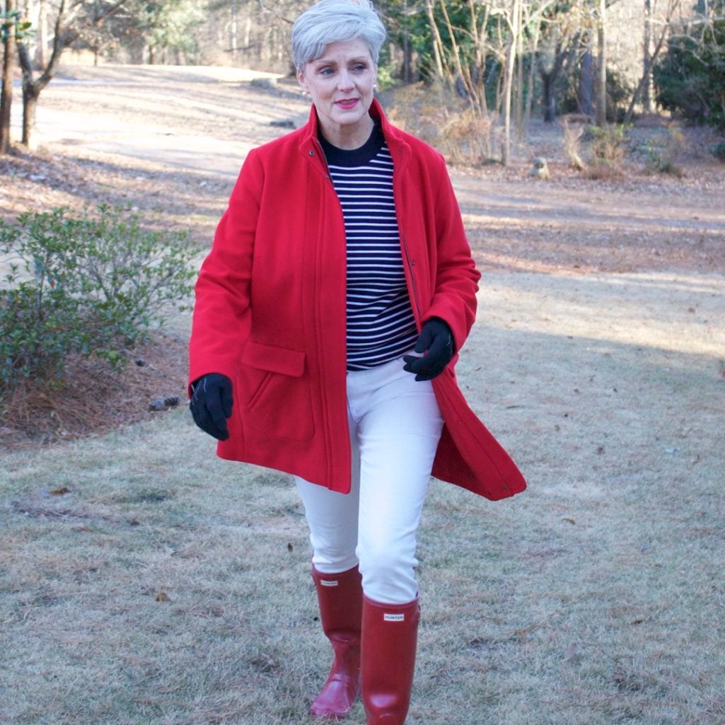 red stadium coat, striped crewneck, white denim, red hunter boots, houndstooth cashmere scarf