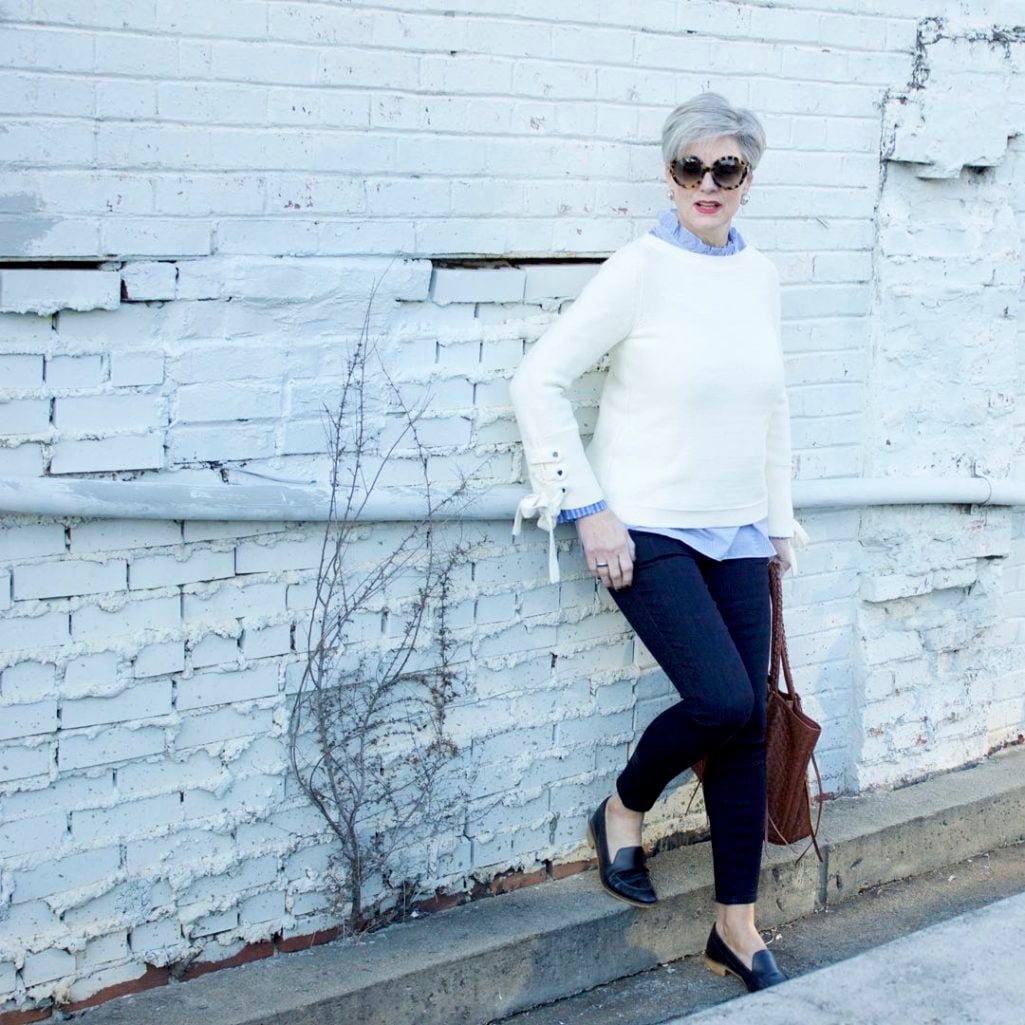 ann taylor grommet sweater, striped ruffled shirt, denim, everlane loafers