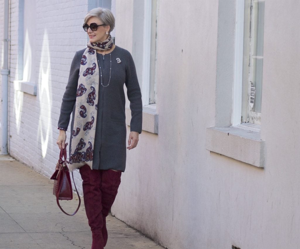 burgundy boots and statement handbag