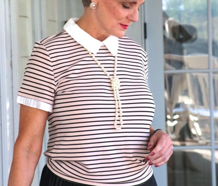 karl lagerfeld striped blouse black pleated skirt, black sandals, clutch