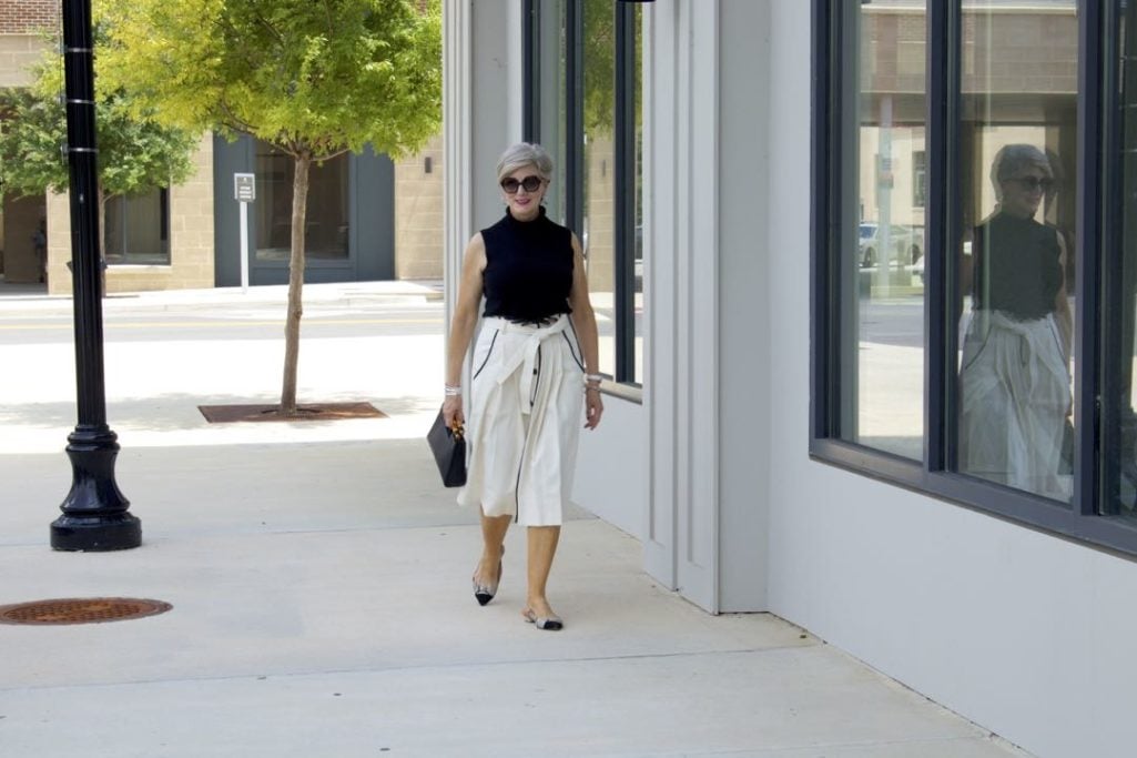 pleated cone denim skirt, black sleeveless turtleneck,