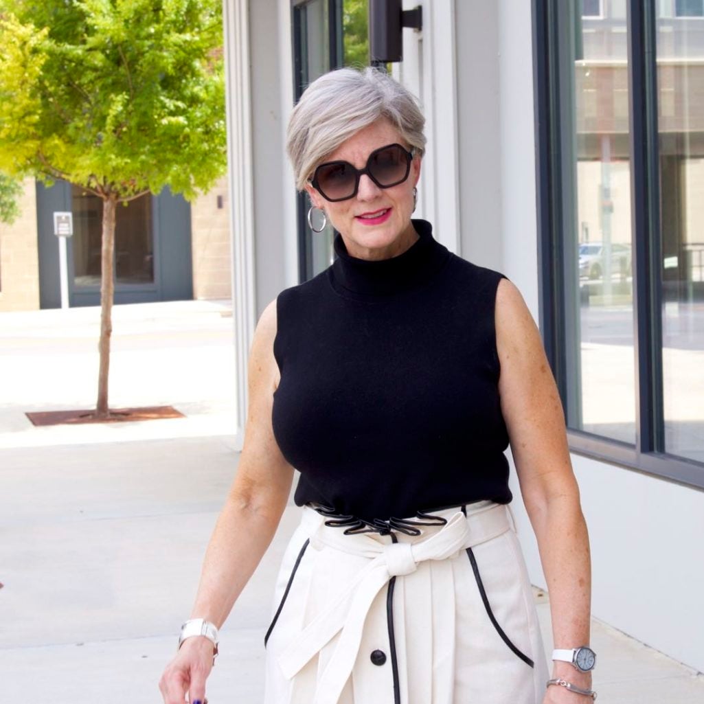 pleated cone denim skirt, black sleeveless turtleneck,