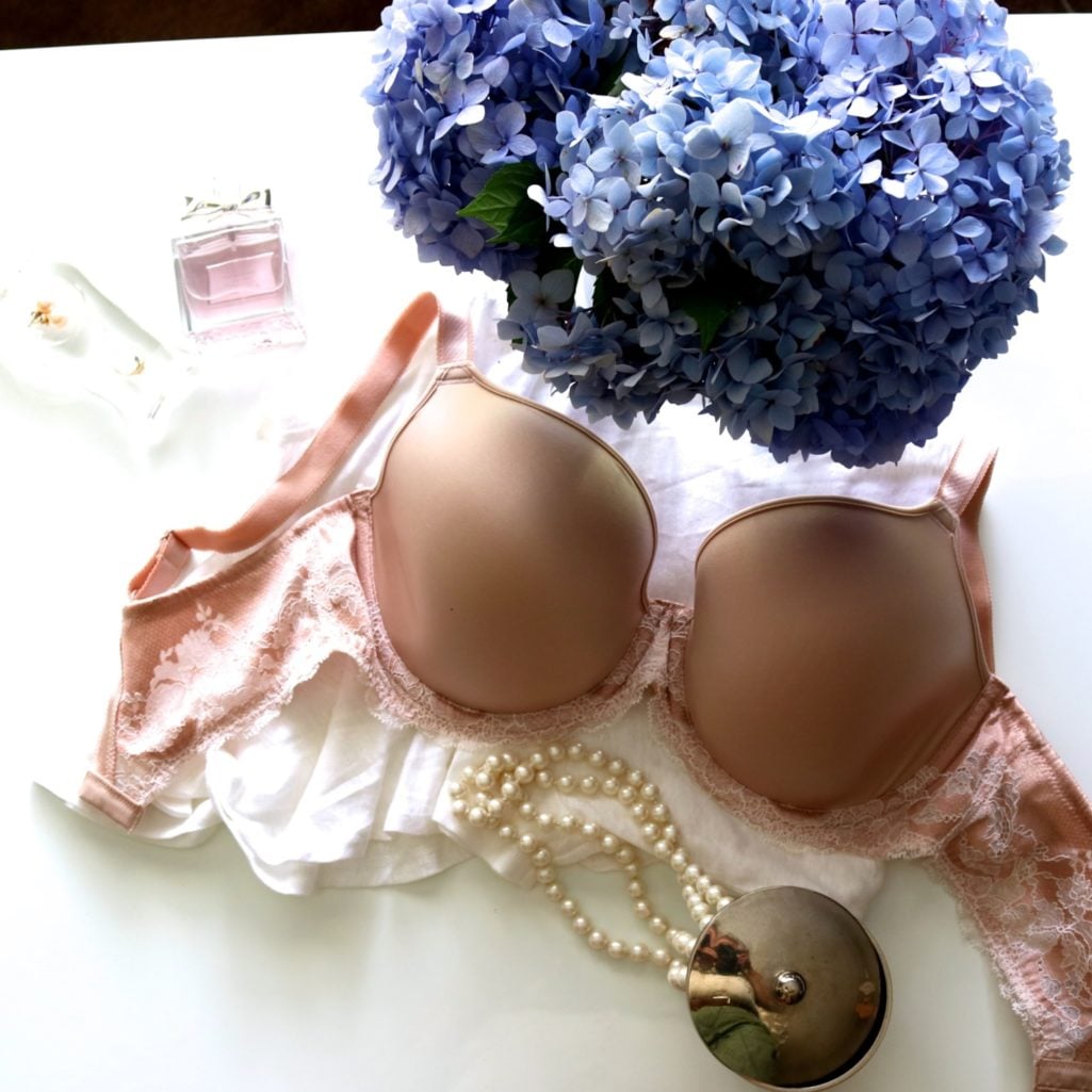 Flat lay of the best bras for women over 50 including styles from Wacoal, Chantelle, Simone Perele, and EBY