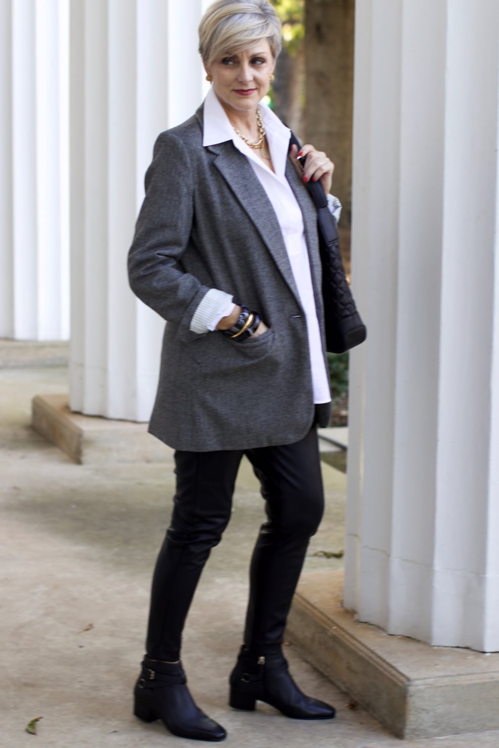 beth at Style at a Certain Age wears faux leather leggings, white shirt, boyfriend blazer, and black booties