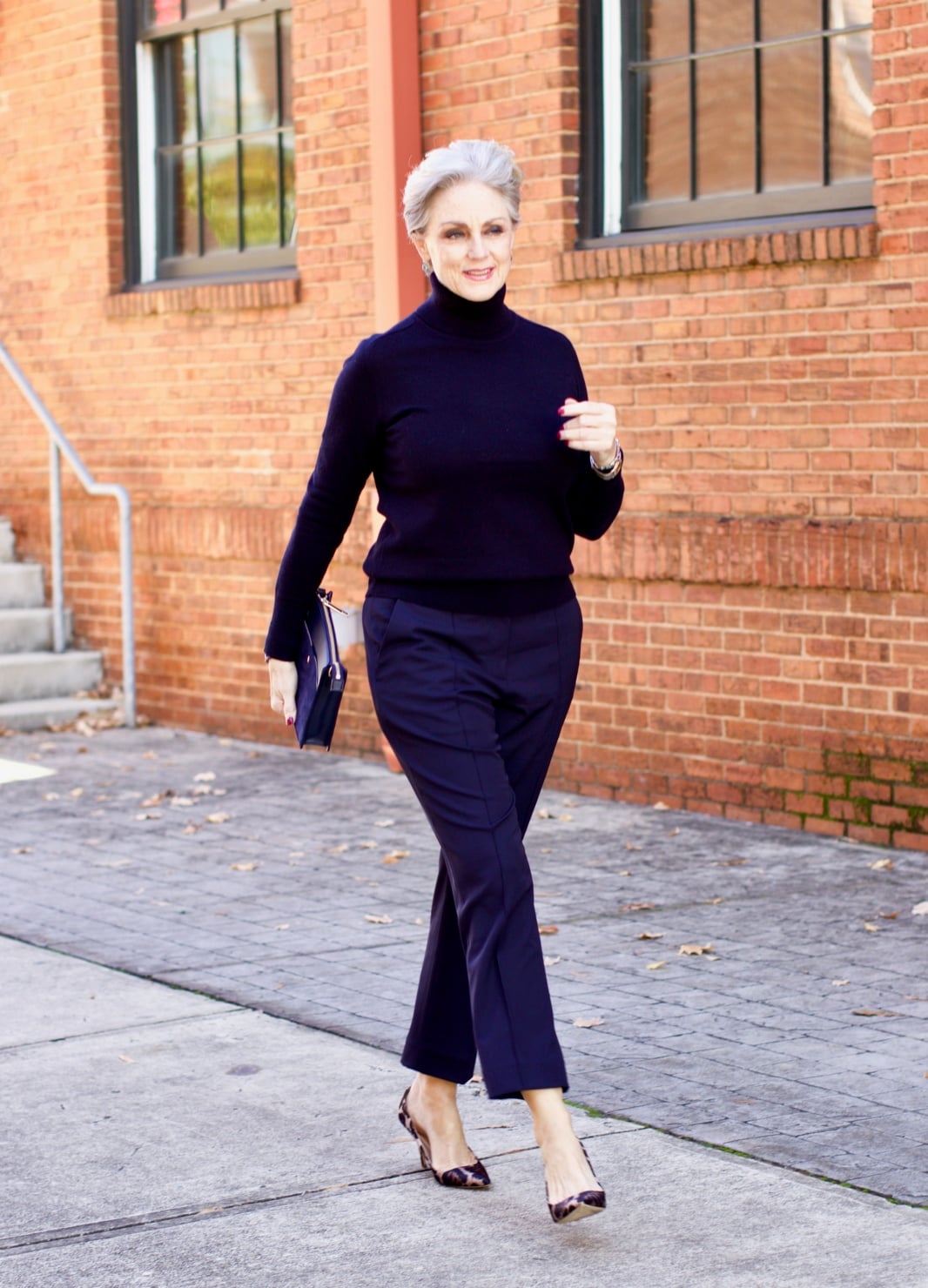 beth from Style at a Certain Age wears an Everlane cashmere turtleneck, Italian weave ankle pants, leopard pumps, and Talbots green overcoat