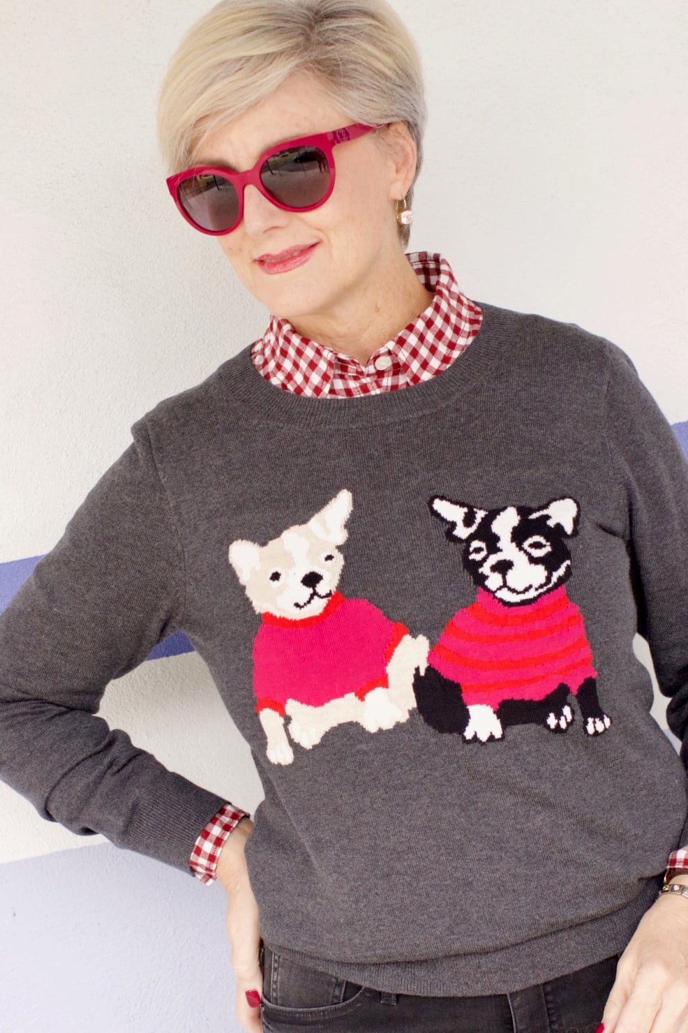 beth from Style at a Certain Age wears a J.Crew Factory high rise skinny jean, burgundy check shirt, french bulldog teddie sweater, quilted puffer jacket