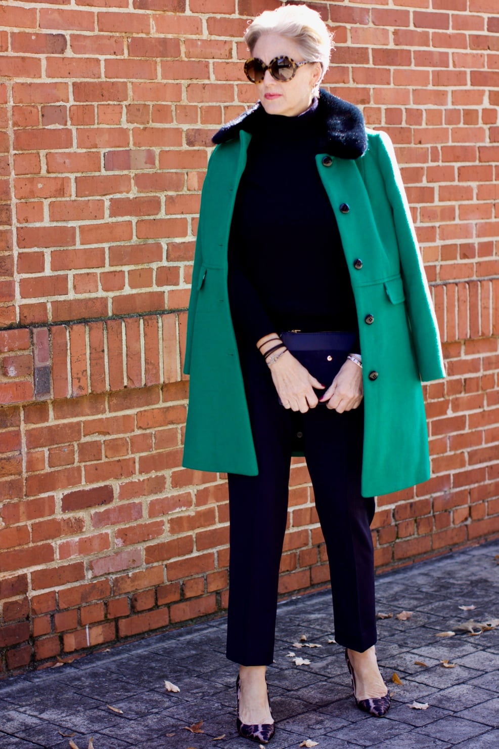 beth from Style at a Certain Age wears an Everlane cashmere turtleneck, Italian weave ankle pants, leopard pumps, and Talbots green overcoat