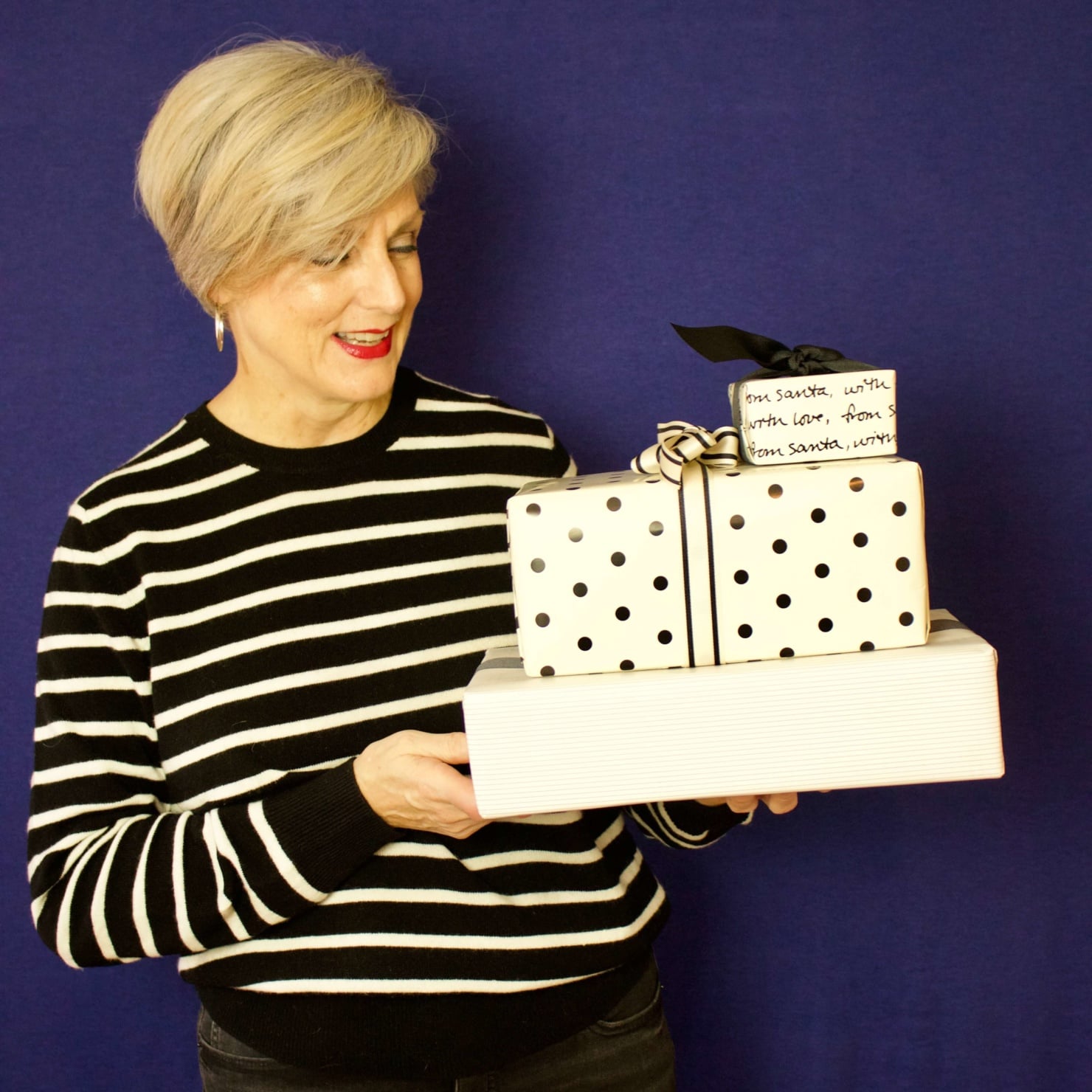 beth from Style at a Certain Age wears a black and white striped cashmere crewneck from Marks & Spencer