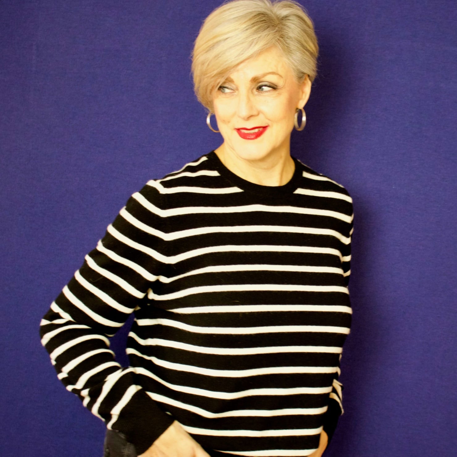 beth from Style at a Certain Age wears a black and white striped cashmere crewneck from Marks & Spencer