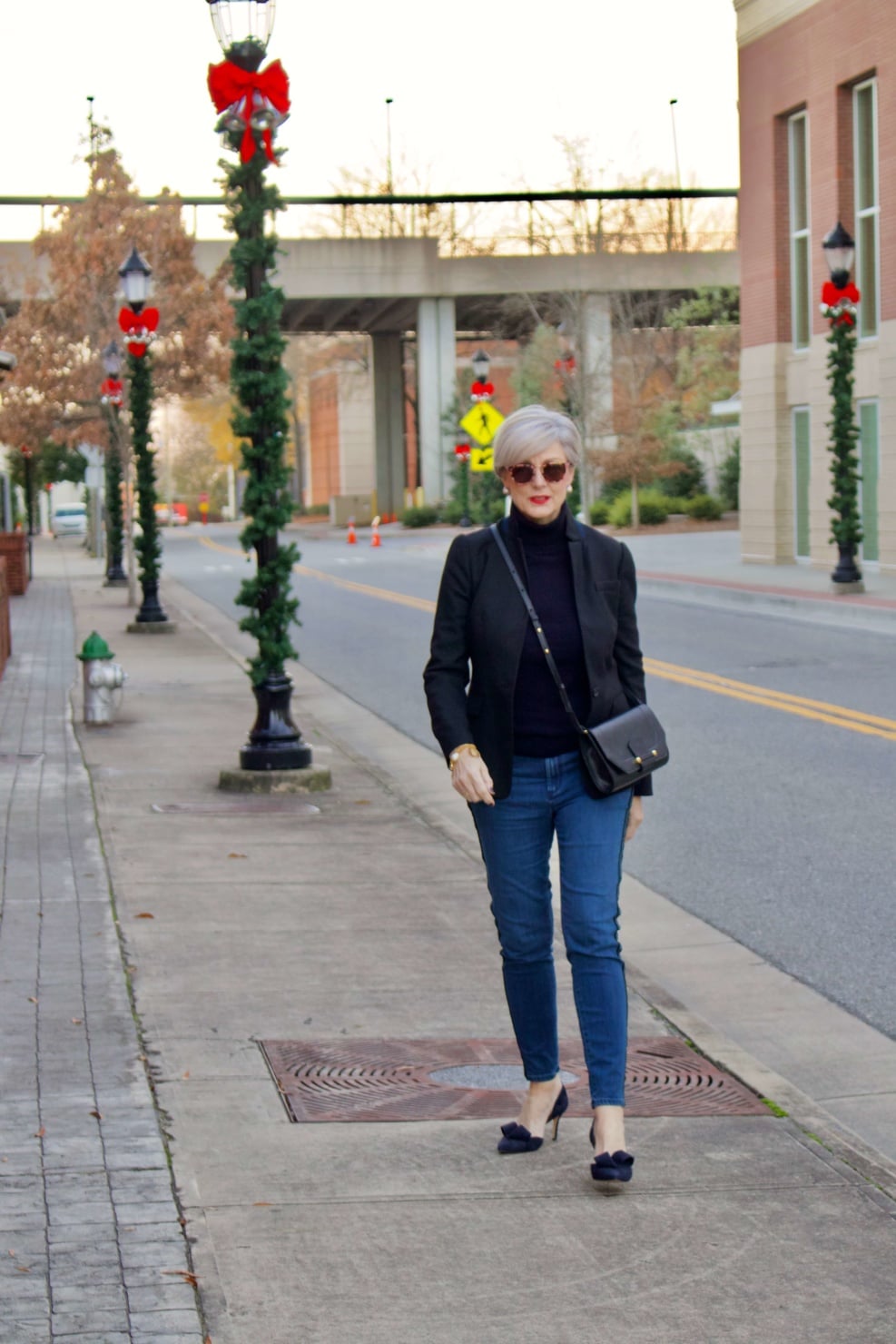 beth from style at a certain age wears tuxedo denim from Ann Taylor, cashmere turtleneck from Everlane and Parker blazer from J.Crew