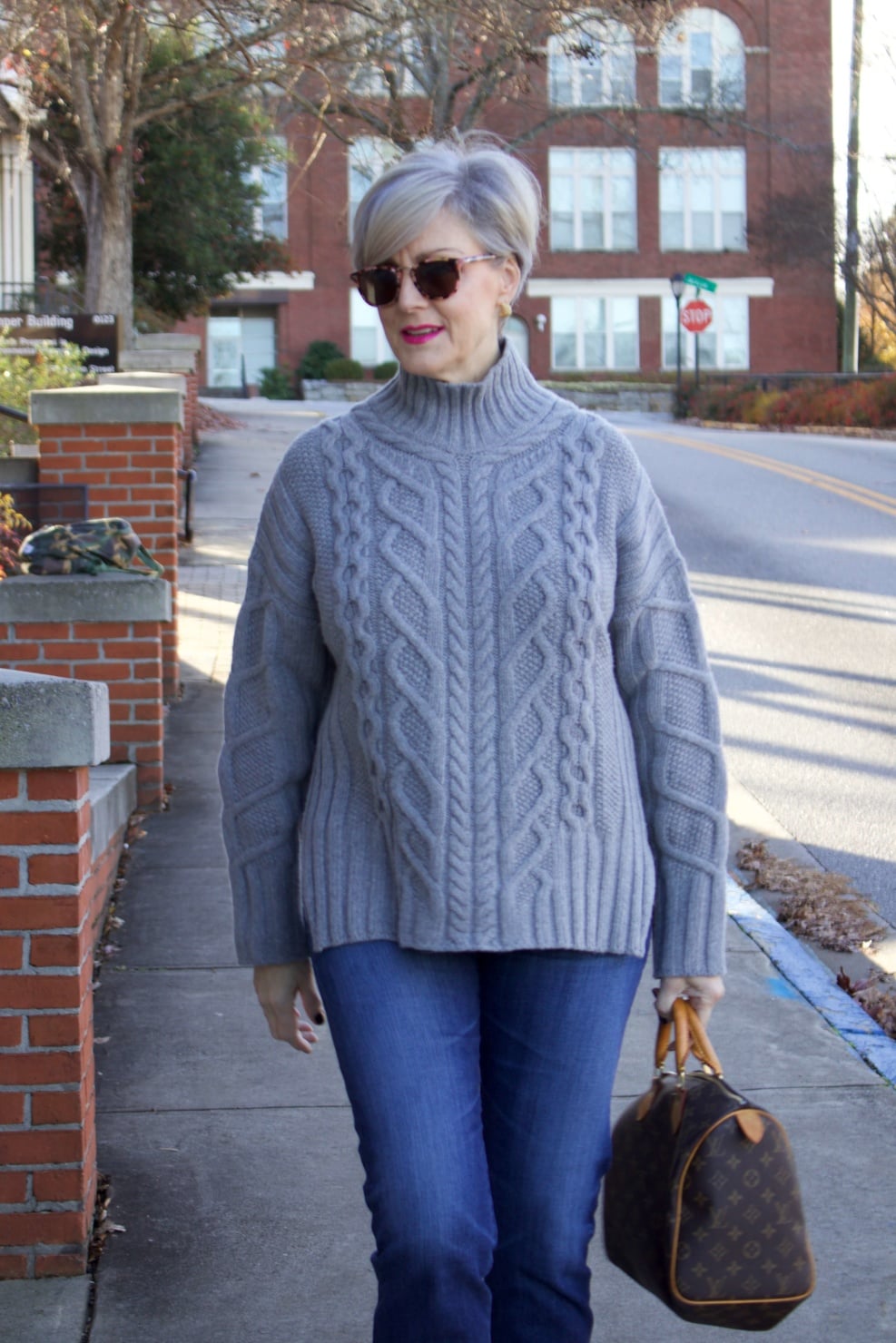 warm cozy sweater. beth from Style at a Certain Age wears a cable knit sweater from Everlane