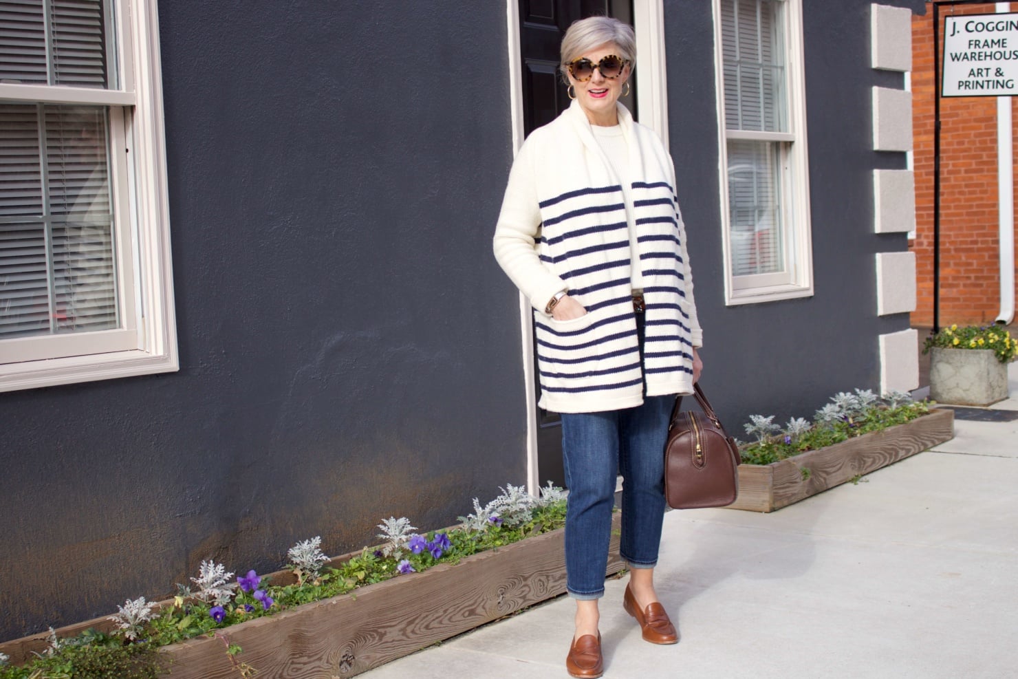 beth from Style at a Certain Age wears a J.Crew cozy striped cardigan, Everlane cashmere crewneck, Talbots girlfriend jeans, J.Crew Ryan loafers