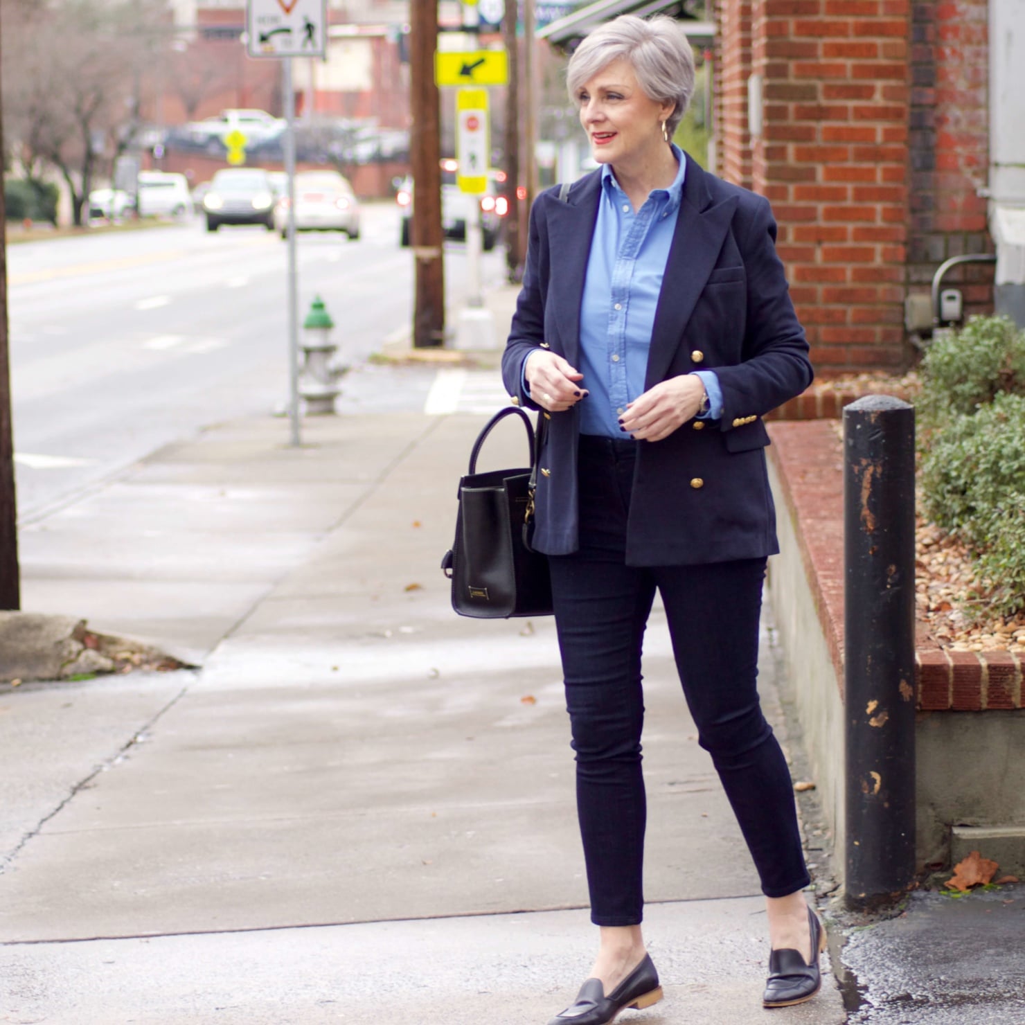 beth from Style at a Certain Age wears a Ralph Lauren navy blue blazer, blue button down, Ann Taylor sailor skinny jeans, and Everlane loafers