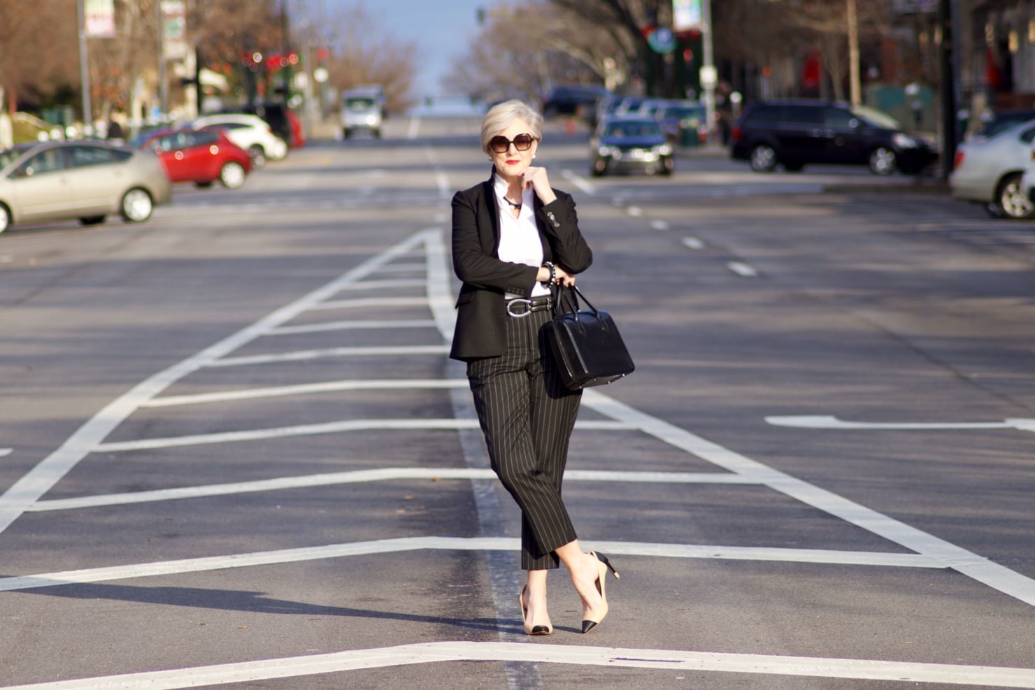 beth from Style at a Certain Age wears Ralph Lauren pinstripe pants, Misook white blouse, J.Crew black blazer, cap toe pumps and black handbag