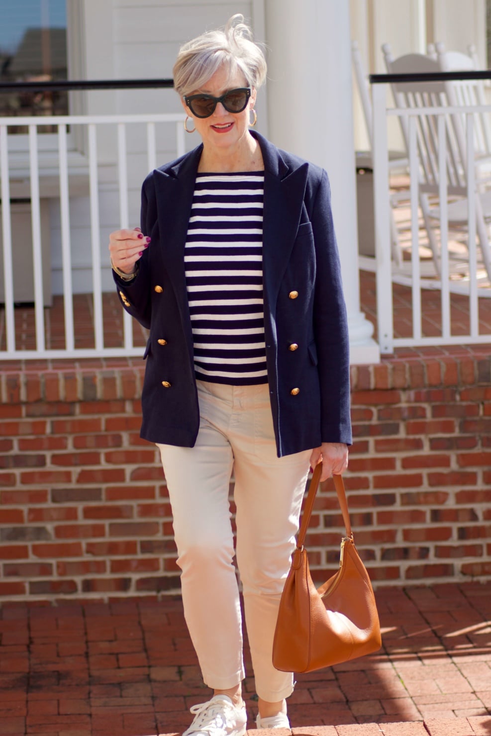 beth from Style at a Certain Age wears J.Crew striped tee, chinos, Ralph Lauren navy blue knit blazer, and white sneakers