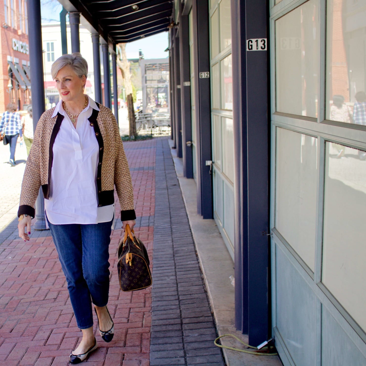 beth from Style at a Certain goes shopping wearing a Lafayette 148 white shirt, St. John Sport sweater, girlfriend jeans, and ballet flats
