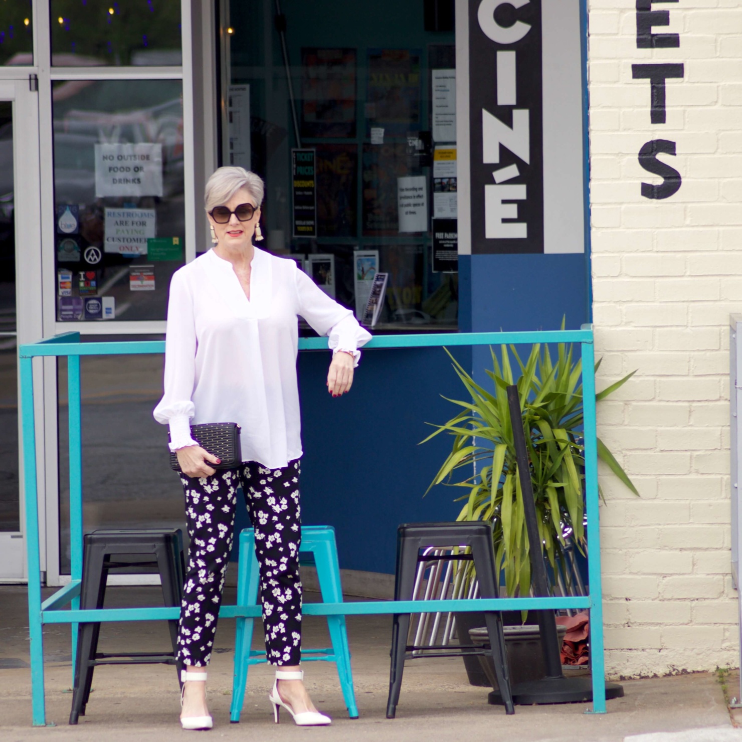 beth from Style at a Certain Age wears an outfit from Lord & Taylor, black pattern pants, white tunic blouse, Sam Edelman shoes