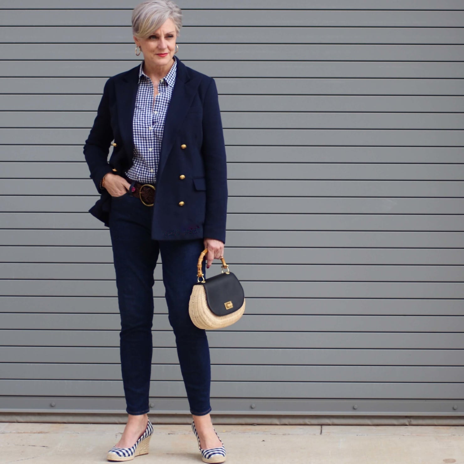 beth from Style at a Certain Age wears a lightweight blazer, gingham shirt, skinny jeans, espadrilles and wicker handbag