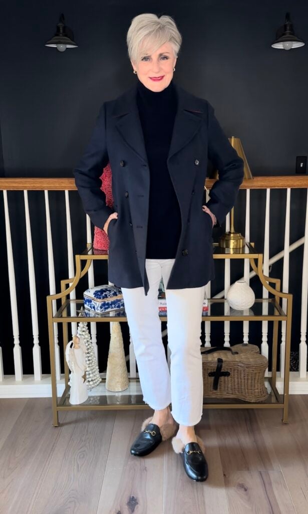 Beth Djalali wearing a classic navy peacoat, navy cashmere turtleneck and white denim.