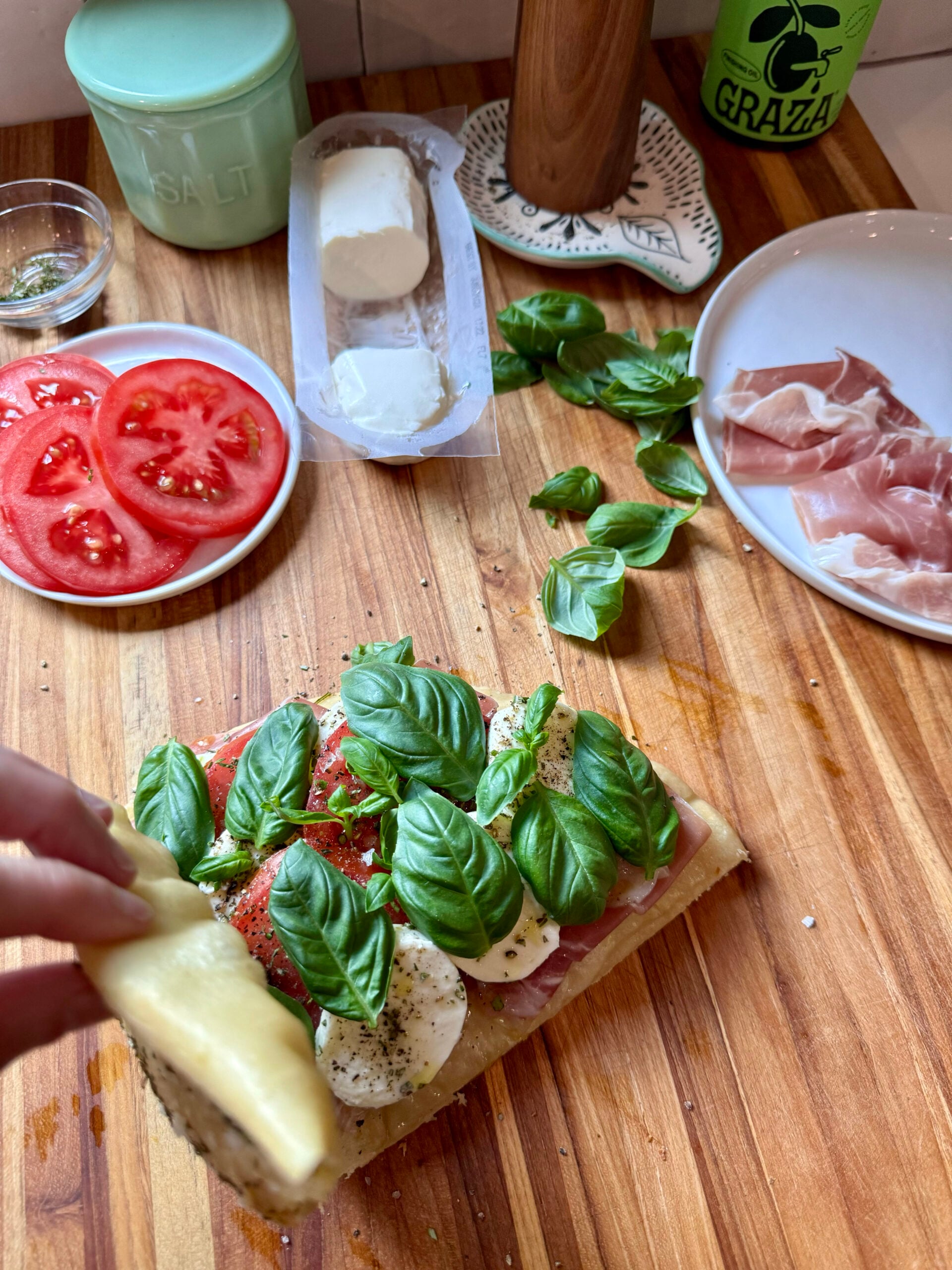 top with basil leaves