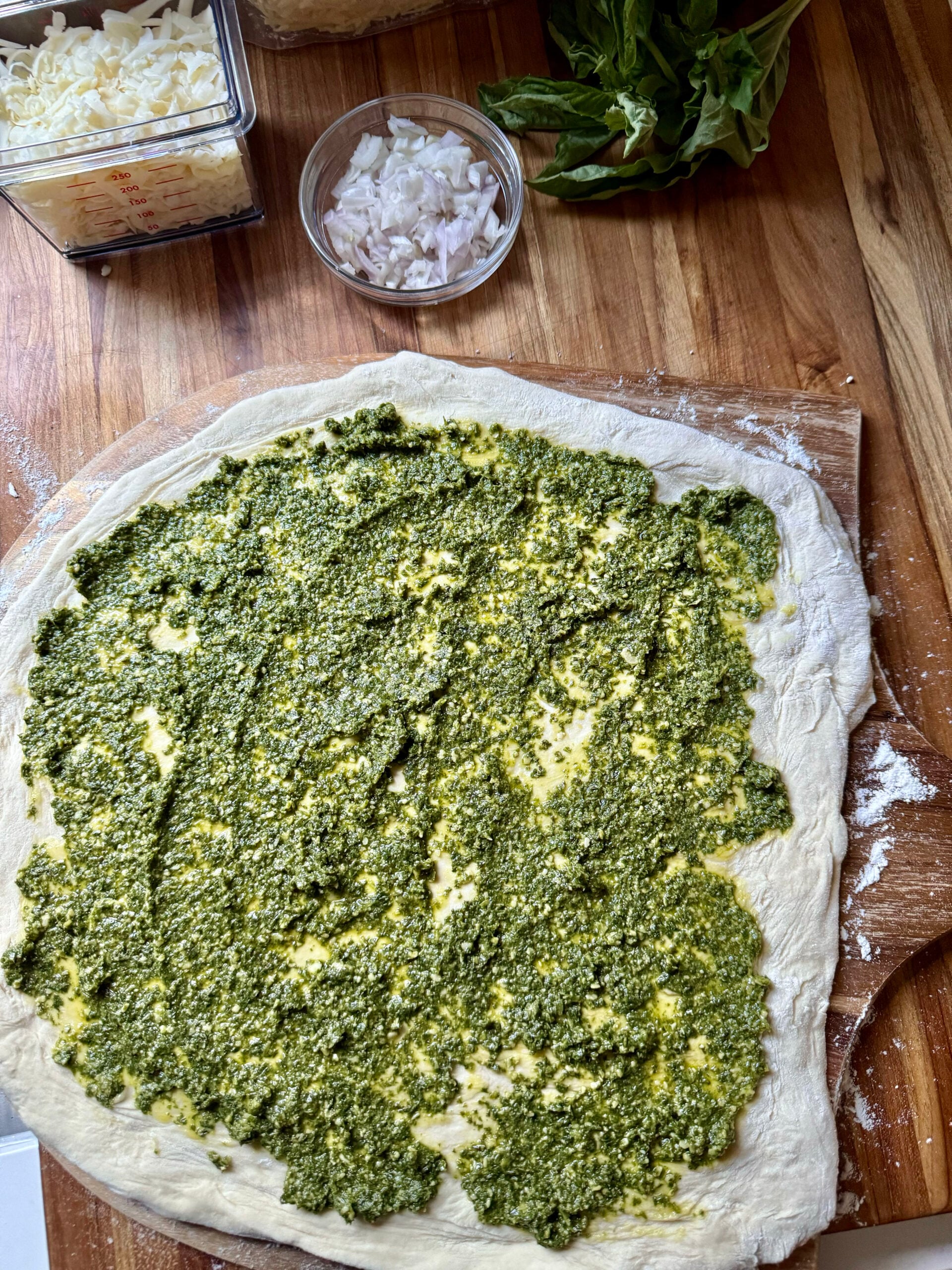 spread pesto on dough