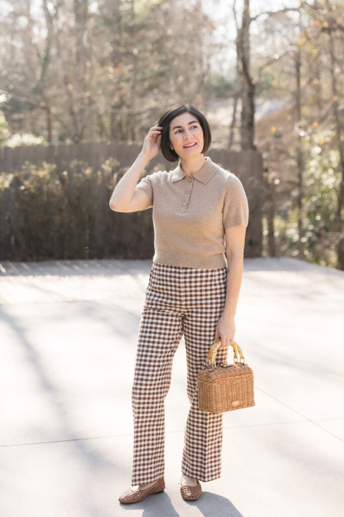 polo sweater, wicker handbag, woven ballet flats, gingham trousers