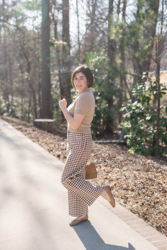 polo sweater, wicker handbag, woven ballet flats, gingham trousers