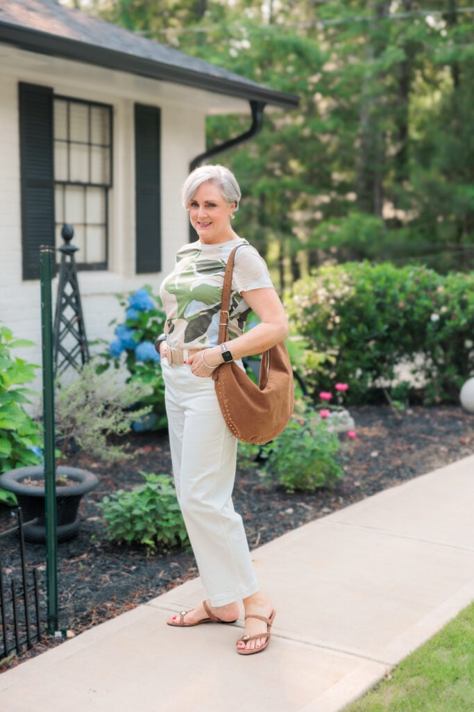 Beth Djalali wearing a classic t-shirt styled with jeans and sandals
