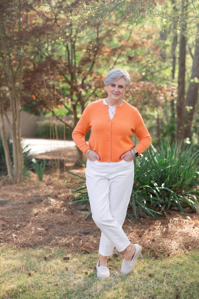 a colorful cardigan and white denim