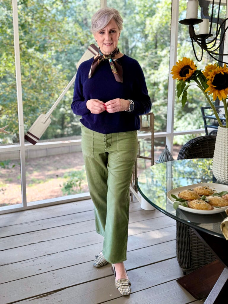 How not to look frumpy and older. Beth Djalali wears a navy cashmere sweater and green chinos.