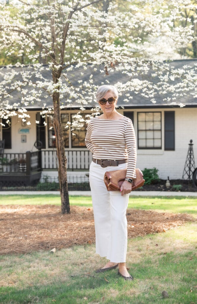 Beth wears a striped top from J.Mclaughlin and white wide leg jeans