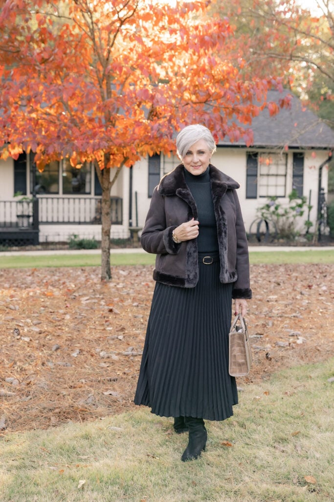 black monochrome base outfit with camel blazer layered on top, stylish outfit idea for mature women over 50