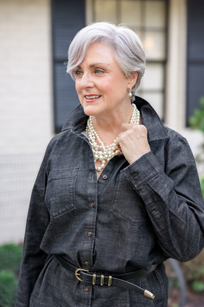 women over 50 statement pearls with black denim shirt modern jewelry look