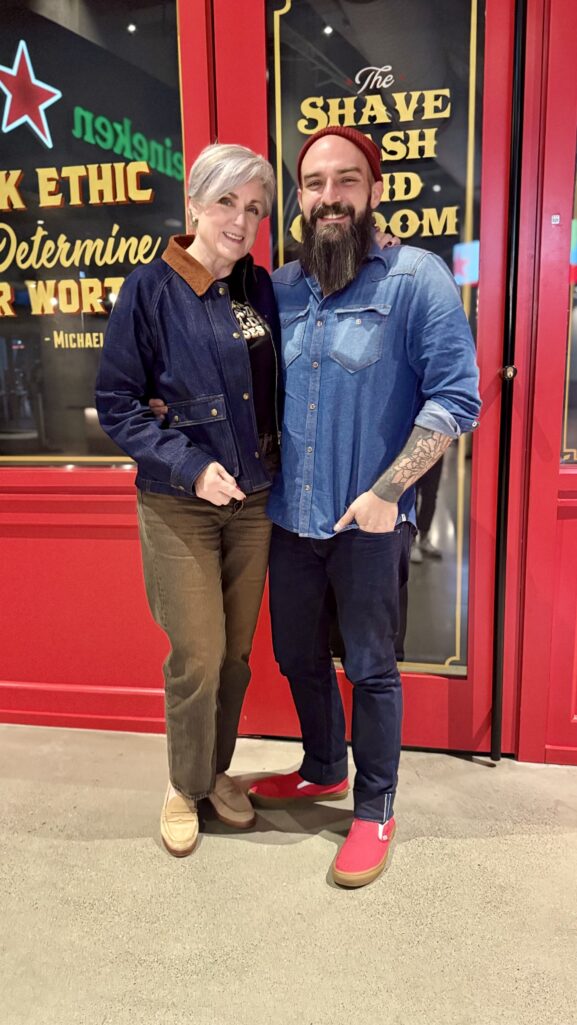 Beth Djalali wears a Beatles graphic tee, Levi’s Ribcage Jeans, and Madewell denim jacket before Paul McCartney concert in Atlanta.