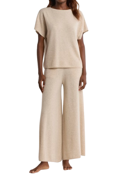 Nordstrom cashmere lounge set in a soft beige hue, featuring a short-sleeve relaxed-fit sweater and matching wide-leg cashmere pants, shown on a model standing barefoot.