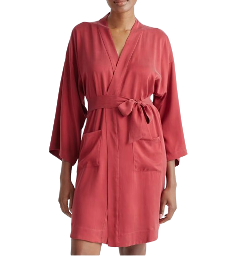 Quince washable silk robe in crimson, featuring a smooth satin-like finish, kimono-style sleeves, a wrap-front silhouette with a matching waist tie, and two front patch pockets, shown on a model.