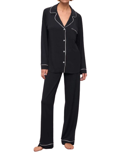 Eberjey Gisele TENCEL™ Modal long pajama set in classic black, featuring a button-front long-sleeve top with white contrast piping and matching relaxed-fit pants with piped hems, shown on a model standing barefoot.