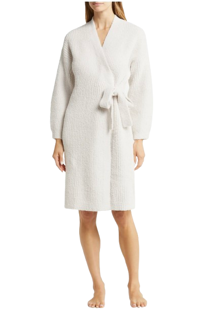 Barefoot Dreams CozyChic side-tie robe in soft ivory, featuring a plush textured knit, long sleeves, and a wrap-front silhouette with a knotted waist tie, shown on a model standing barefoot.