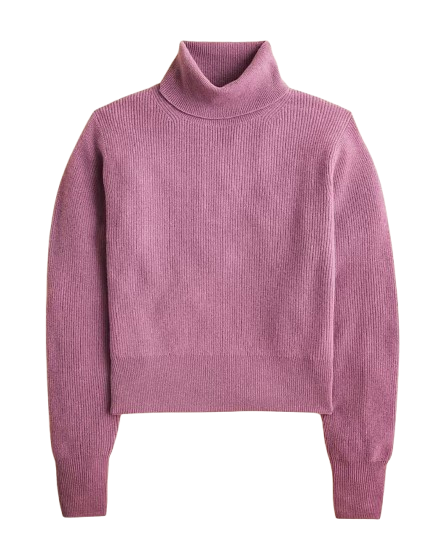 J.Crew ribbed cashmere turtleneck sweater in a dusty rose shade with long sleeves and a relaxed, slightly cropped fit.