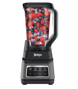 Ninja countertop blender with a clear pitcher filled with mixed berries, featuring preset buttons for smoothies, ice cream, and blending speeds on a black base.