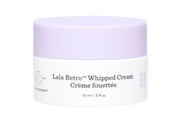 Drunk Elephant Lala Retro Whipped Cream moisturizer in a white jar with a soft lavender lid and minimalist black text label.
