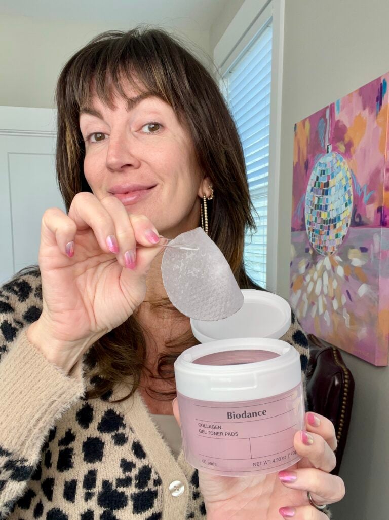 Jennifer holding Biodance Collagen Gel Toner Pad with tweezers from pink container - toner pads for smooth skin over 40