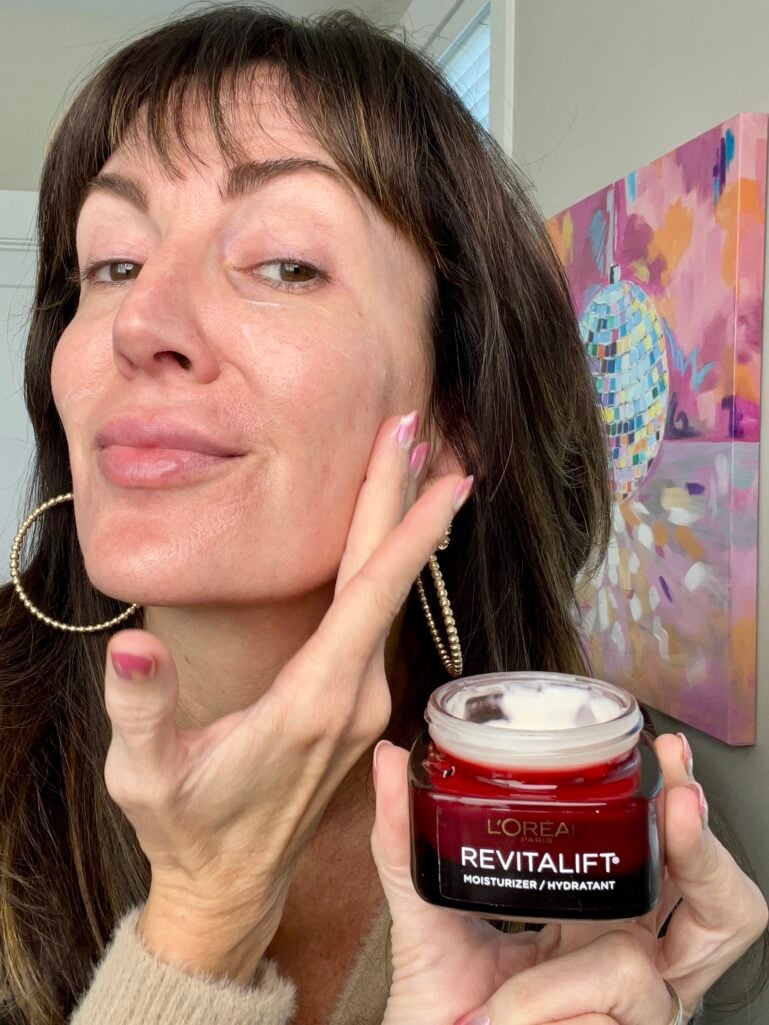 Jennifer applying L'Oreal Revitalift Triple Power Moisturizer to face - hydrating anti-aging moisturizer over 40