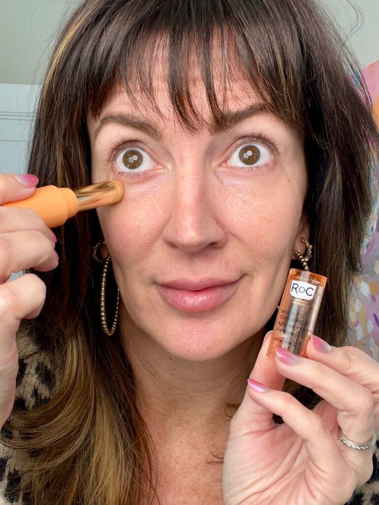 ennifer playfully applying ROC Multi Correxion eye balm with applicator - eye cream for smoother skin over 40